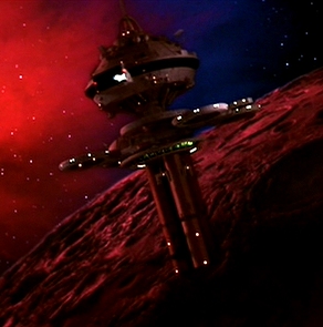 Glamour shot of the R-1 station Regula I, with the Constitution Refit Class USS Enterprise in the background against the glowing patterns of the Mutara Nebula (from Star Trek II)